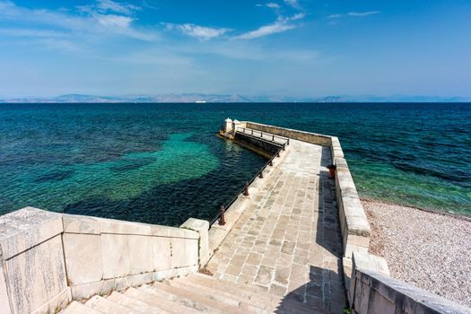 Kaiser Wilhelm's bridge and walkway a stone swim platform in Corfu, Greece