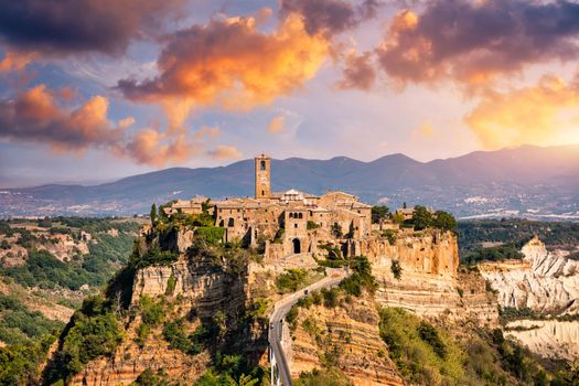 The famous Civita di Bagnoregio on a sunny day. Province of Viterbo, Lazio, Italy. Medieval town on the mountain, Civita di Bagnoregio, popular touristic stop at Tuscany, Italy.