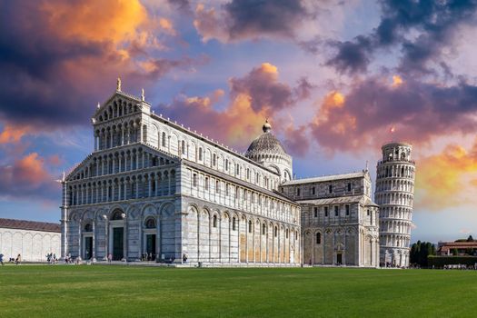 Pisa Cathedral and the Leaning Tower in a sunny day in Pisa, Italy. Pisa Cathedral with Leaning Tower of Pisa on Piazza dei Miracoli in Pisa, Tuscany, Italy.