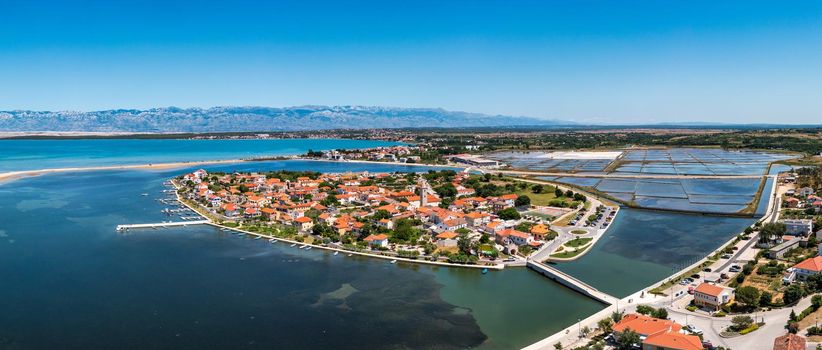 Historic town of Nin laguna aerial view with Velebit mountain background, Dalmatia region of Croatia. Aerial view of the famous Nin lagoon and medieval in Croatia