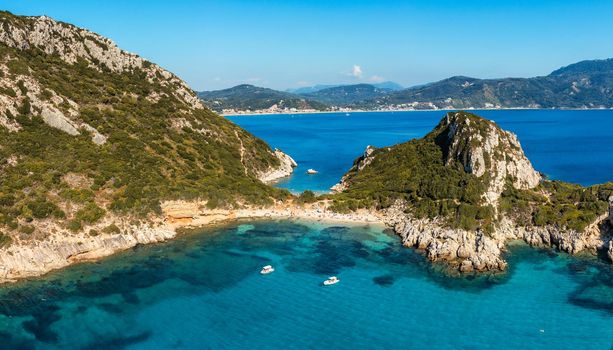 Porto Timoni is an amazing beautiful double beach in Corfu, Greece. Porto Timoni beach at Afionas is a paradise double beach with crystal clear azure water in Corfu, Ionian island, Greece, Europe