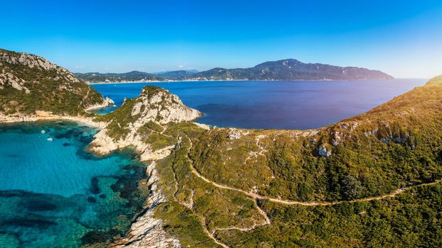 Porto Timoni is an amazing beautiful double beach in Corfu, Greece. Porto Timoni beach at Afionas is a paradise double beach with crystal clear azure water in Corfu, Ionian island, Greece, Europe