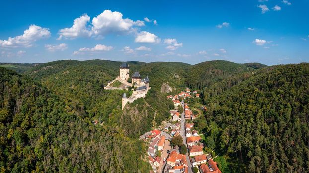 Royal Castle Karlstejn. Central Bohemia, Karlstejn village, Czechia. Aerial view to The Karlstejn castle. Royal palace founded King Charles IV. Amazing gothic monument in Czech Republic, Europe.