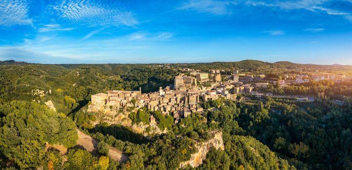 Sorano, a town built on a tuff rock, is one of the most beautiful city in Italy. Sorano as an ancient medieval hill town hanging from a tuff stone over the Lente River, Tuscany, Italy.