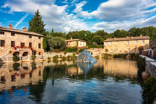 Thermal bath town of Bagno Vignoni, Italy during sunrise. Old thermal baths in the medieval village Bagno Vignoni, Tuscany, Italy. Medieval thermal baths in village Bagno Vignoni, Tuscany, Italy 