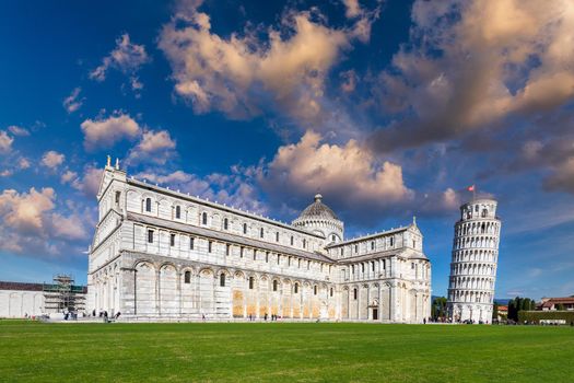 Pisa Cathedral and the Leaning Tower in a sunny day in Pisa, Italy. Pisa Cathedral with Leaning Tower of Pisa on Piazza dei Miracoli in Pisa, Tuscany, Italy.