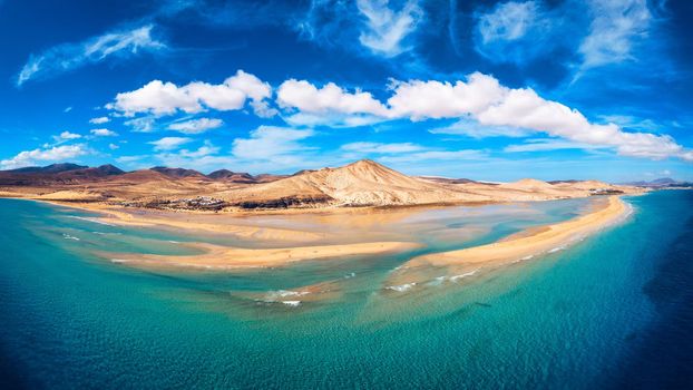 Jandia Peninsula, Risco del Paso, Playas de Sotavento and Laguna de Sotavento, Fuerteventura, Canary Islands, Spain, Atlantic, Europe. Kitesurfing flying in the ocean, Sotavento beach, Fuerteventura