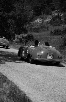 URBINO - ITALY - JUN 16 - 2022 : PORSCHE 356 1500 SPEEDSTER 1955 on an old racing car in rally Mille Miglia 2022 the famous italian historical race (1927-1957