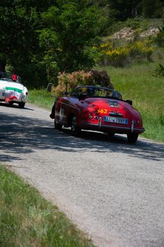 URBINO - ITALY - JUN 16 - 2022 : PORSCHE 356 1500 SPEEDSTER 1955 on an old racing car in rally Mille Miglia 2022 the famous italian historical race (1927-1957