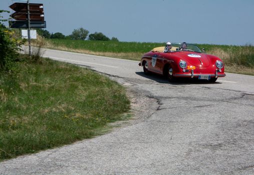 URBINO - ITALY - JUN 16 - 2022 : PORSCHE 356 1500 SPEEDSTER 1954 on an old racing car in rally Mille Miglia 2022 the famous italian historical race (1927-1957