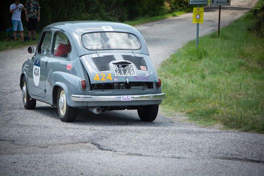 URBINO - ITALY - JUN 16 - 2022 : FIAT 600 1956 on an old racing car in rally Mille Miglia 2022 the famous italian historical race (1927-1957