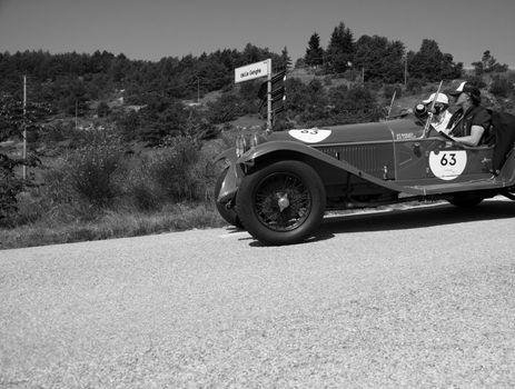 URBINO - ITALY - JUN 16 - 2022 : ALFA ROMEO 6C 1750 GRAN SPORT CARR. SPORT 1930 on an old racing car in rally Mille Miglia 2022 the famous italian historical race (1927-1957