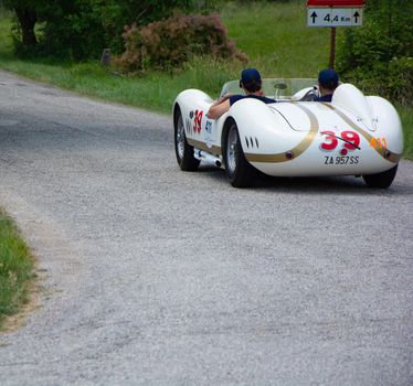 URBINO - ITALY - JUN 16 - 2022 : MASERATI 200 SI 1956 on an old racing car in rally Mille Miglia 2022 the famous italian historical race (1927-1957