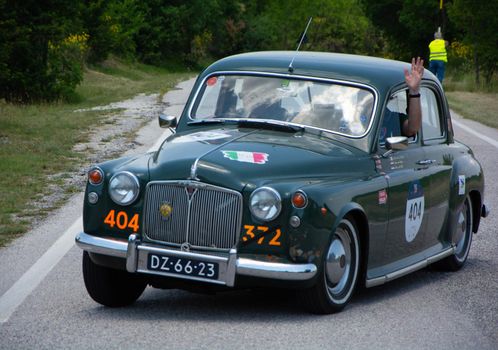 URBINO - ITALY - JUN 16 - 2022 : ROVER 75 1956 on an old racing car in rally Mille Miglia 2022 the famous italian historical race (1927-1957
