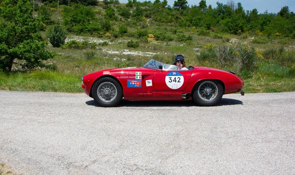 URBINO - ITALY - JUN 16 - 2022 : ALFA ROMEO 1900 SPORT SPIDER 1954 on an old racing car in rally Mille Miglia 2022 the famous italian historical race (1927-1957