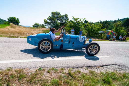 URBINO - ITALY - JUN 16 - 2022 : BUGATTI T37 1927 on an old racing car in rally Mille Miglia 2022 the famous italian historical race (1927-1957