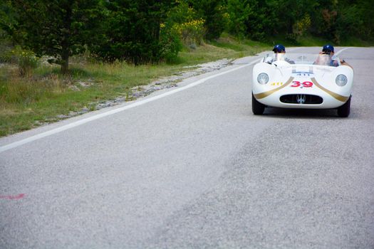 URBINO - ITALY - JUN 16 - 2022 : MASERATI 200 SI 1956 on an old racing car in rally Mille Miglia 2022 the famous italian historical race (1927-1957