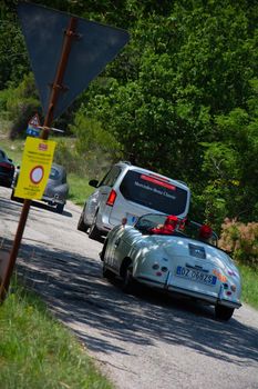 URBINO - ITALY - JUN 16 - 2022 : PORSCHE 356 1500 SPEEDSTER 1955 on an old racing car in rally Mille Miglia 2022 the famous italian historical race (1927-1957