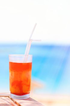 Cocktail by the sea - summer vacation, travel and summertime relax concept. Beach party time