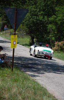 URBINO - ITALY - JUN 16 - 2022 : TRIUMPH TR3 SPORTS 1956 on an old racing car in rally Mille Miglia 2022 the famous italian historical race (1927-1957