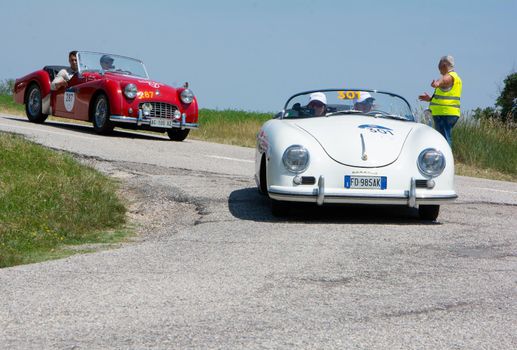 URBINO - ITALY - JUN 16 - 2022 : PORSCHE 356 1500 SPEEDSTER 1954 on an old racing car in rally Mille Miglia 2022 the famous italian historical race (1927-1957