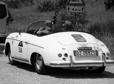 URBINO - ITALY - JUN 16 - 2022 : PORSCHE 356 1500 SPEEDSTER 1955 on an old racing car in rally Mille Miglia 2022 the famous italian historical race (1927-1957