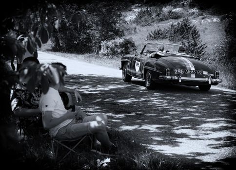 URBINO - ITALY - JUN 16 - 2022 : MERCEDES-BENZ 190 SL 1957 on an old racing car in rally Mille Miglia 2022 the famous italian historical race (1927-1957