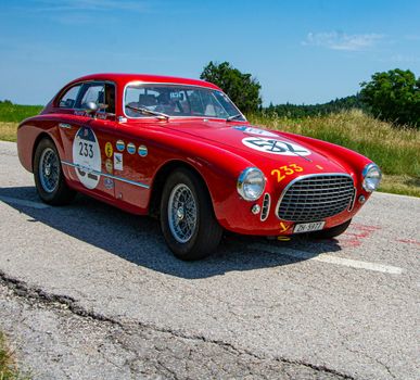 URBINO - ITALY - JUN 16 - 2022 : FERRARI 195 INTER COUPE GHIA 1951 on an old racing car in rally Mille Miglia 2022 the famous italian historical race (1927-1957