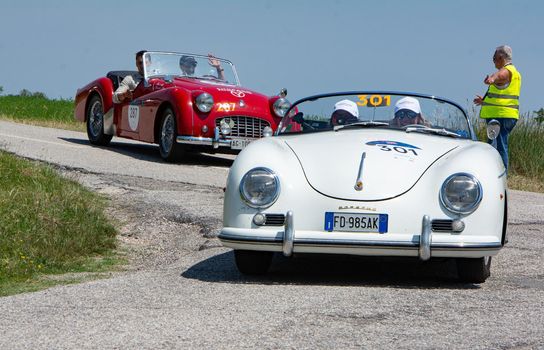 URBINO - ITALY - JUN 16 - 2022 : PORSCHE 356 1500 SPEEDSTER 1954 on an old racing car in rally Mille Miglia 2022 the famous italian historical race (1927-1957