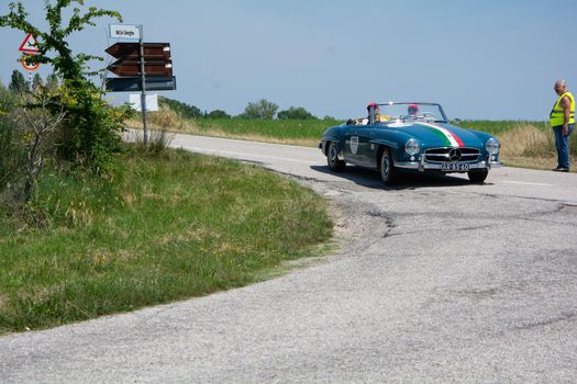 URBINO - ITALY - JUN 16 - 2022 : MERCEDES-BENZ 190 SL 1957 on an old racing car in rally Mille Miglia 2022 the famous italian historical race (1927-1957