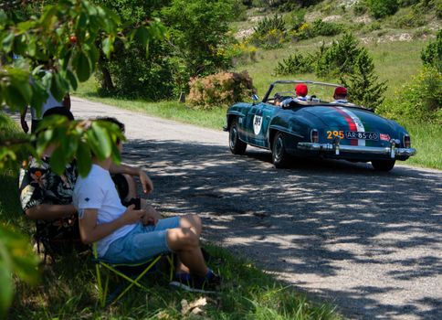 URBINO - ITALY - JUN 16 - 2022 : MERCEDES-BENZ 190 SL 1957 on an old racing car in rally Mille Miglia 2022 the famous italian historical race (1927-1957