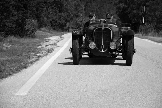 URBINO - ITALY - JUN 16 - 2022 : DELAHAYE 135 CS 1936 on an old racing car in rally Mille Miglia 2022 the famous italian historical race (1927-1957