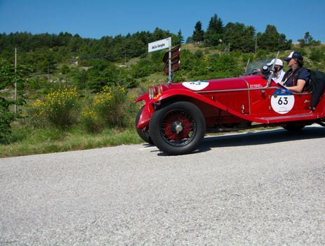 URBINO - ITALY - JUN 16 - 2022 : ALFA ROMEO 6C 1750 GRAN SPORT CARR. SPORT 1930 on an old racing car in rally Mille Miglia 2022 the famous italian historical race (1927-1957