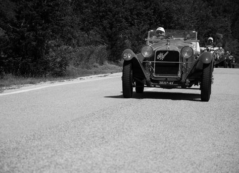 URBINO - ITALY - JUN 16 - 2022 : ALFA ROMEO 6C 1750 GRAN SPORT CARR. SPORT 1930 on an old racing car in rally Mille Miglia 2022 the famous italian historical race (1927-1957