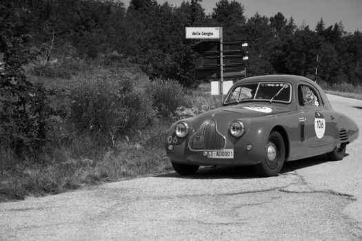 URBINO - ITALY - JUN 16 - 2022 : FIAT 1100 [508 C] BERLINETTA MM 1938 on an old racing car in rally Mille Miglia 2022 the famous italian historical race (1927-1957