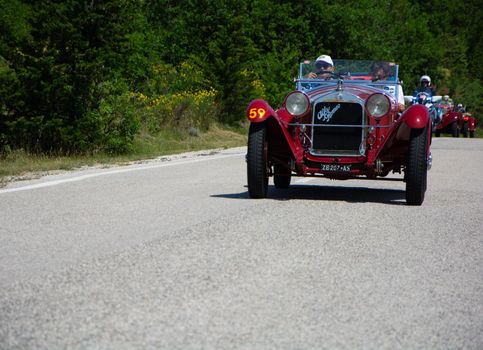 URBINO - ITALY - JUN 16 - 2022 : ALFA ROMEO 6C 1750 GRAN SPORT CARR. SPORT 1930 on an old racing car in rally Mille Miglia 2022 the famous italian historical race (1927-1957