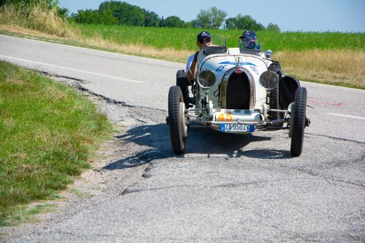 URBINO - ITALY - JUN 16 - 2022 : LANCIA LAMBA V SERIE CASARO 1925 on an old racing car in rally Mille Miglia 2022 the famous italian historical race (1927-1957