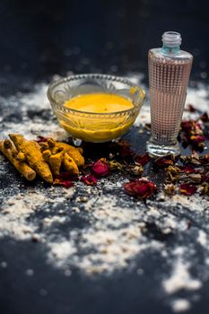 Gram flour or chickpea flour well mixed with turmeric using rose water in a glass bowl and making gram flour face mask for maintaining the pH of the skin.