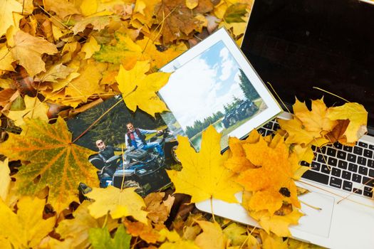 photo book on the yellow leaves top view. rustick photo of autumn composition.