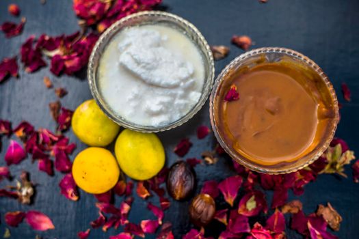 Nutmeg face mask to treat to even out discolorations and pigmentation on your face on the wooden surface consisting of Nutmeg powder, lemon juice, and curd.