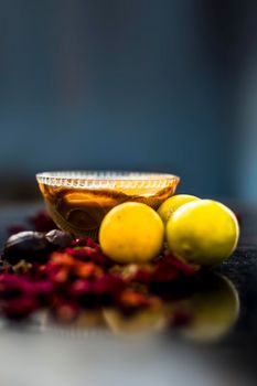 Nutmeg face mask to treat to even out discolorations and pigmentation on your face on the wooden surface consisting of Nutmeg powder, lemon juice, and curd.