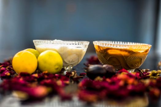 Nutmeg face mask to treat to even out discolorations and pigmentation on your face on the wooden surface consisting of Nutmeg powder, lemon juice, and curd.