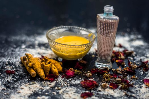 Gram flour or chickpea flour well mixed with turmeric using rose water in a glass bowl and making gram flour face mask for maintaining the pH of the skin.