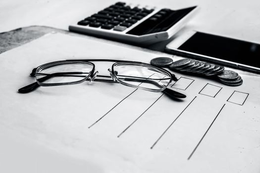 Close up of workplace of businessman or finance consultant isolated on white using credit card, cell phone, pen and calculator like things.