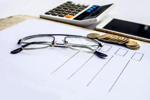 Close up of workplace of businessman or finance consultant isolated on white using credit card, cell phone, pen and calculator like things.