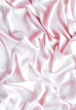 Elegant fabric texture, abstract backdrop and modern pastel colours concept - Pink soft silk waves, flatlay background