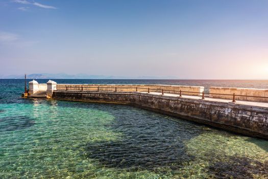 Kaiser Wilhelm's bridge and walkway a stone swim platform in Corfu, Greece