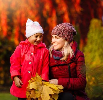 Colorful autumn leaves, happy family