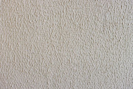 concrete wall background. Embossed uneven rough surface.