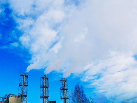 Power station chimneys. Smoke stacks at a power plant.